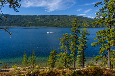 Boat wake across the lake